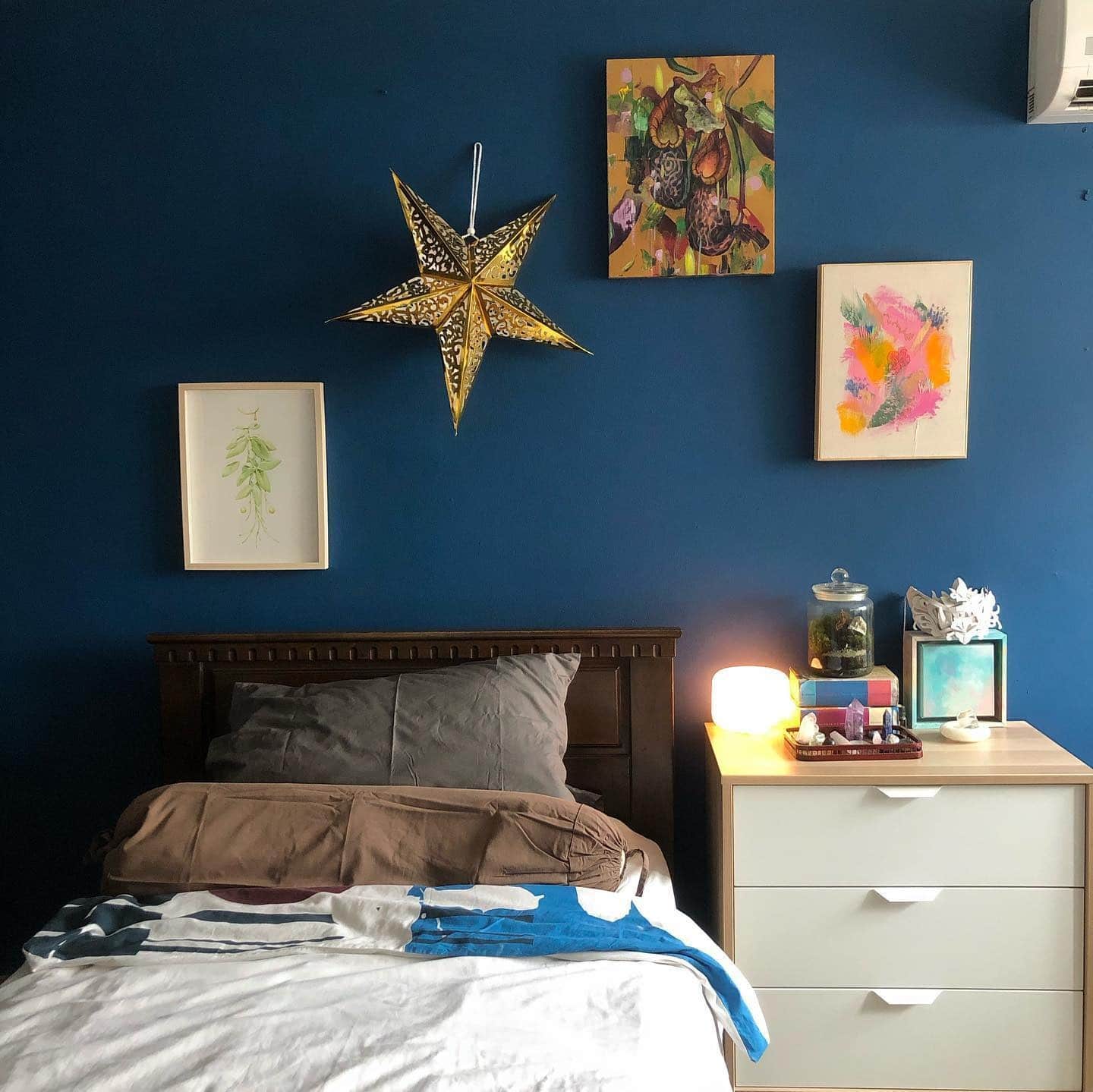 3. Artistic Dark Blue Gallery Bedroom - dark blue bedroom ideas