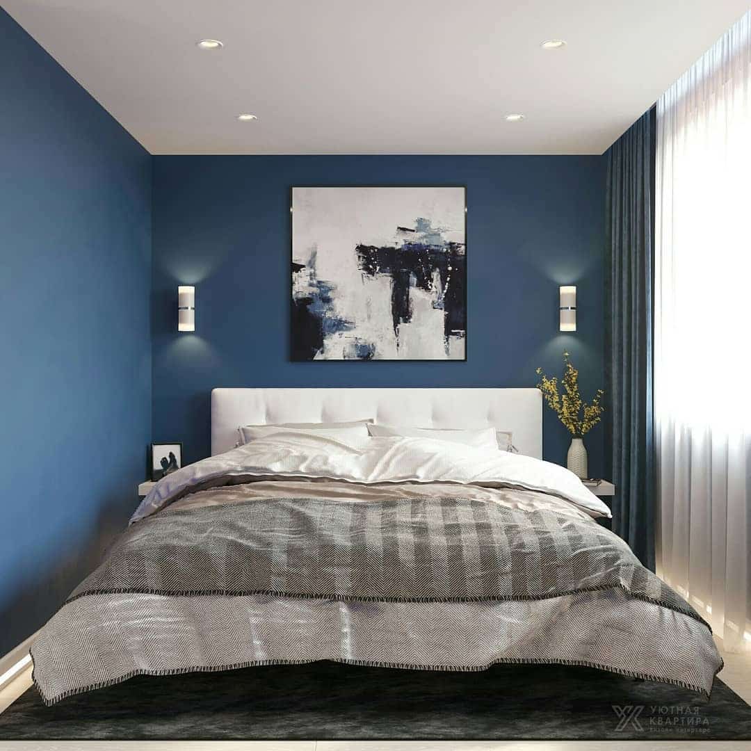 4. Contemporary Hotel-Style Blue Retreat - dark blue bedroom ideas