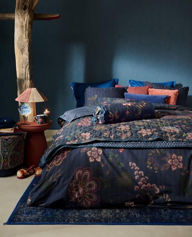5. Pattern-Rich Blue Bohemian Bedroom - dark blue bedroom ideas