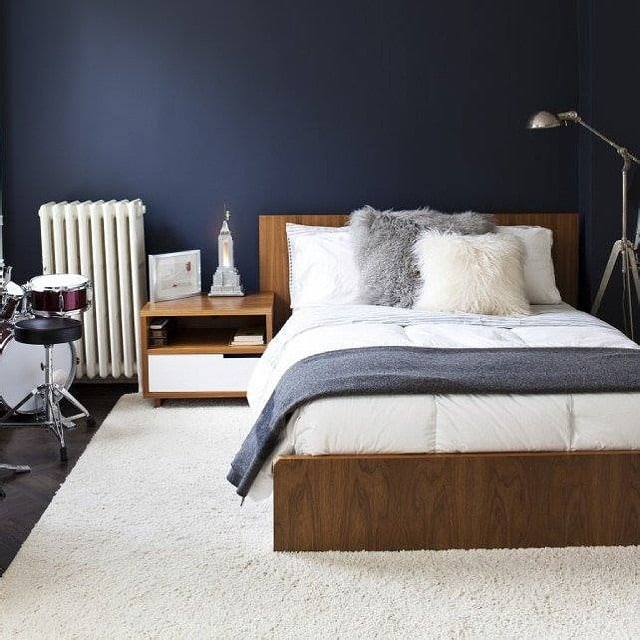 6. Dark Blue Minimalist Wood Accent Bedroom - dark blue bedroom ideas
