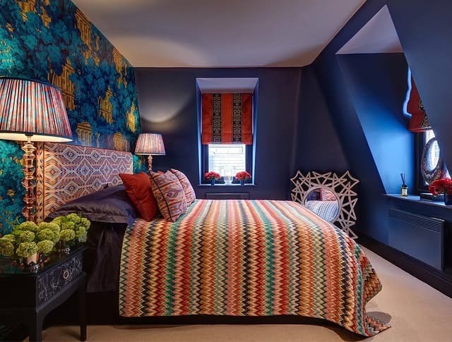 7. Moody Blue Luxe Bedroom with Metallic Accents - dark blue bedroom ideas