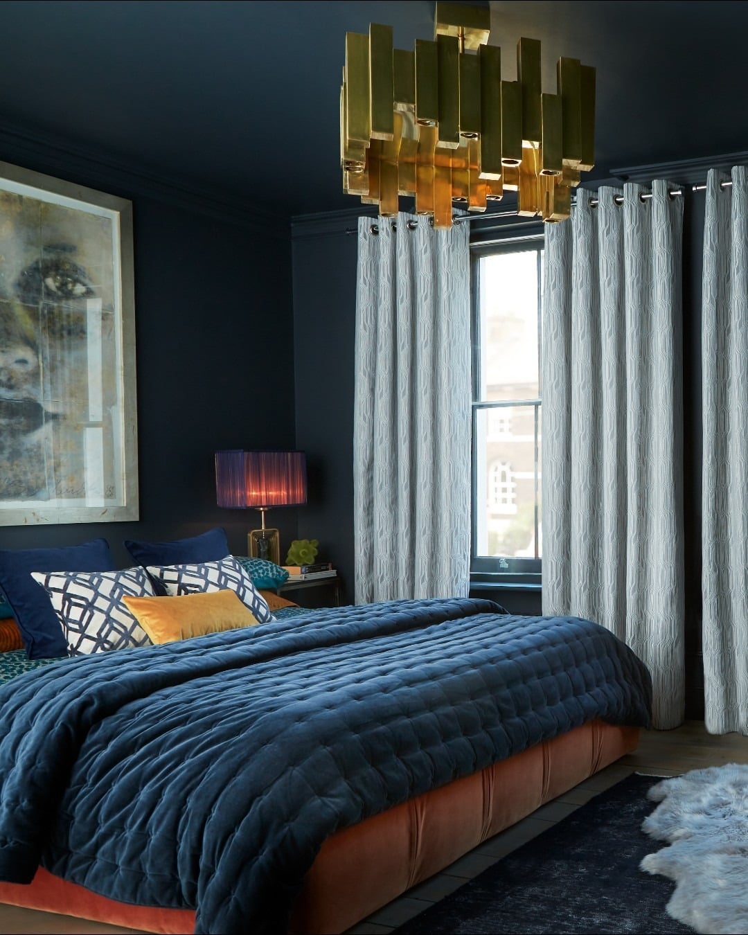 8. Soft Blue Draped Bedroom with Natural Light - dark blue bedroom ideas