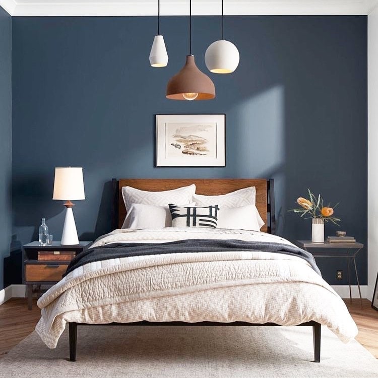9. Balanced Blue Bedroom with Warm Wood Tones - dark blue bedroom ideas