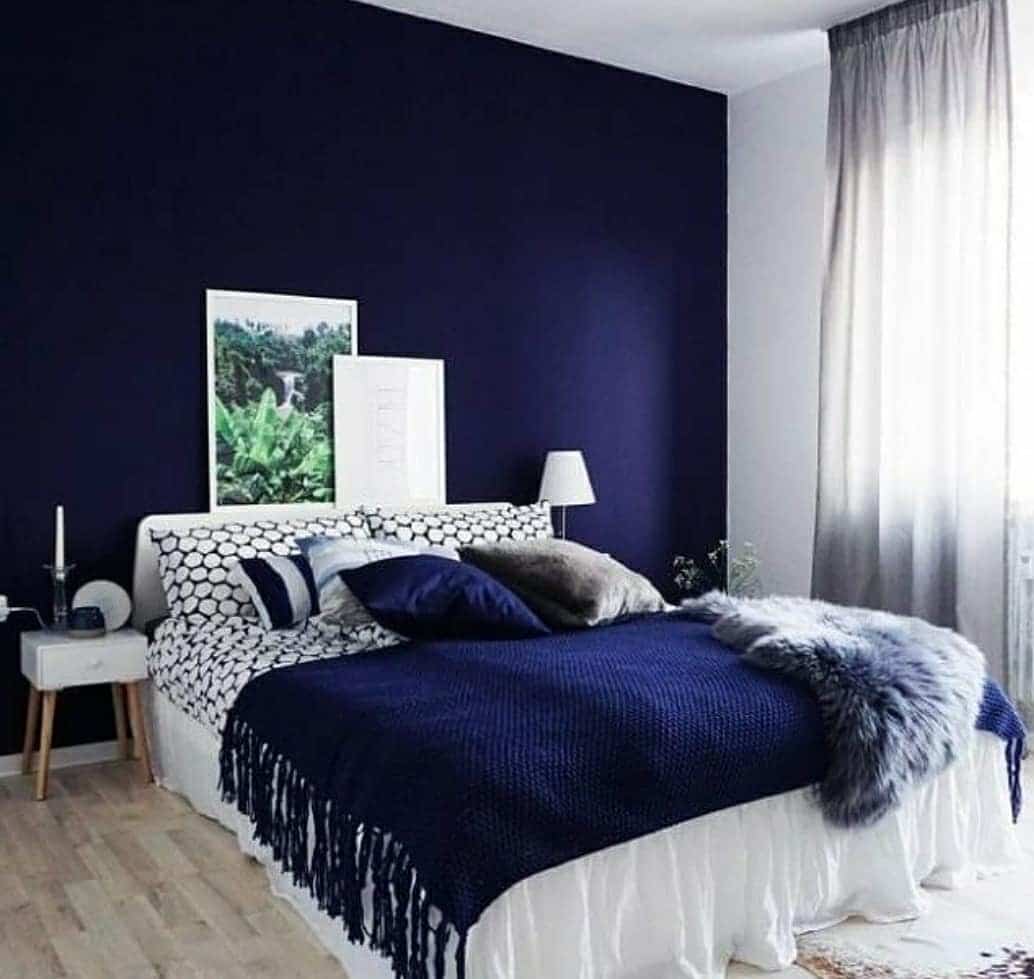 11. Dark Blue and White Scandinavian Bedroom - dark blue bedroom ideas