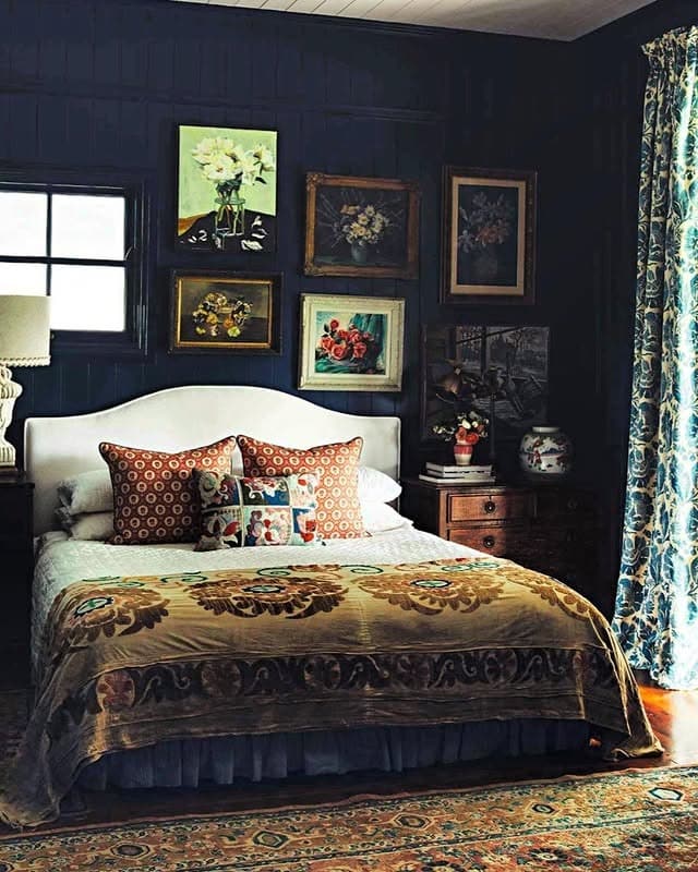 12. Vintage Dark Blue Bedroom with Collected Art - dark blue bedroom ideas