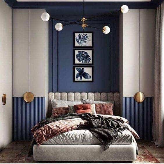 13. Modern Panelled Dark Blue Bedroom with Brass Accents - dark blue bedroom ideas