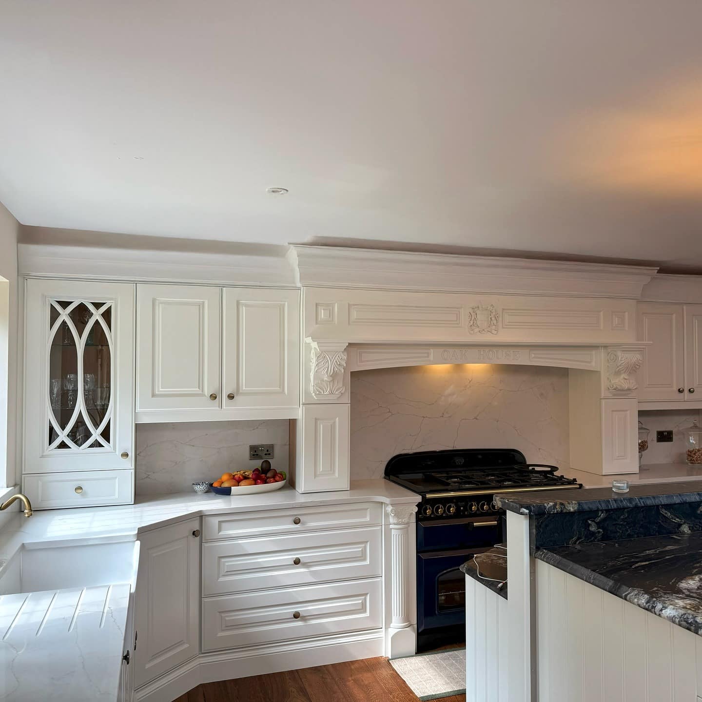 6. Classic White Victorian Kitchen with Ornate Mantel - victorian style kitchen ideas