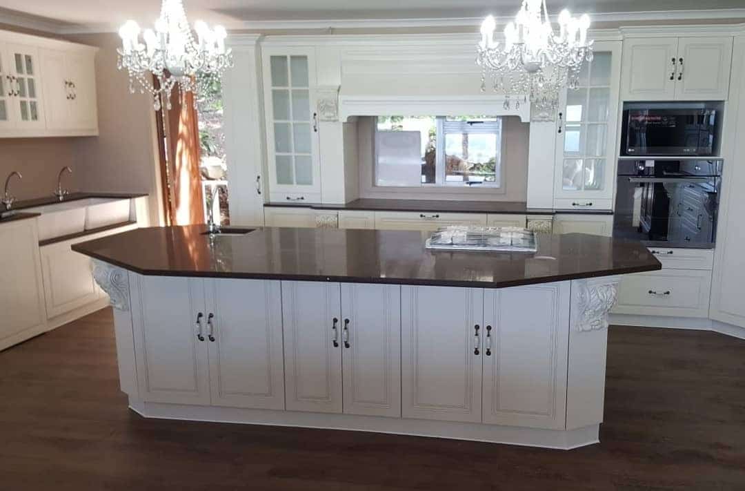 20. Ivory Victorian Kitchen with Decorative Island Panels - victorian style kitchen ideas