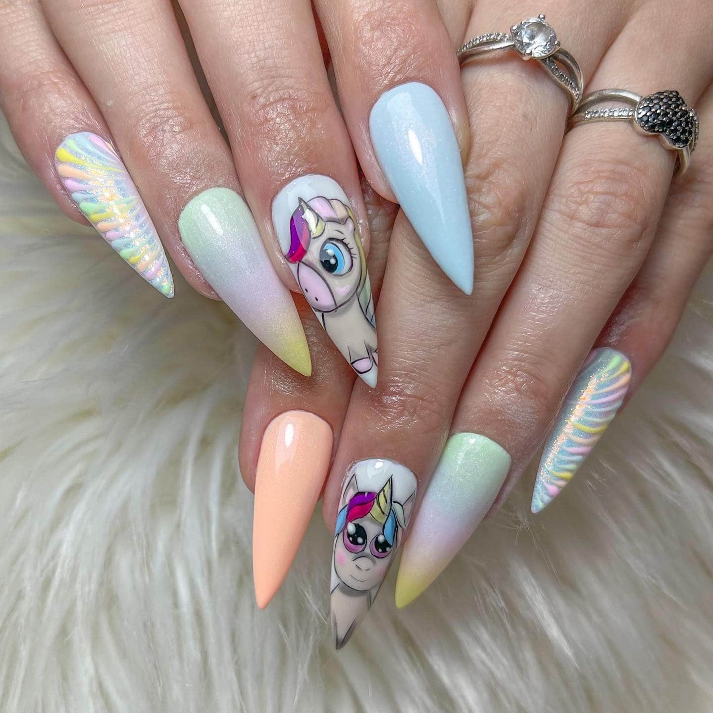 19. Pastel Stiletto Unicorn Character Nails - unicorn nail ideas