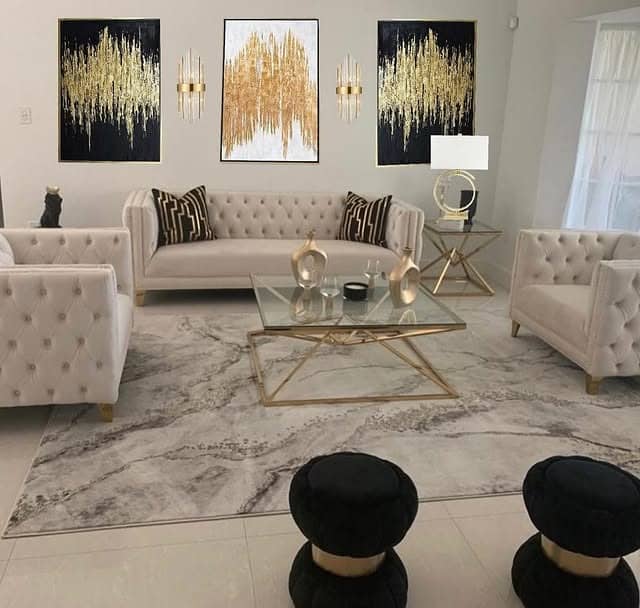 1. Modern Glam Living Room in Soft Black and Brushed Gold - black and gold living room ideas