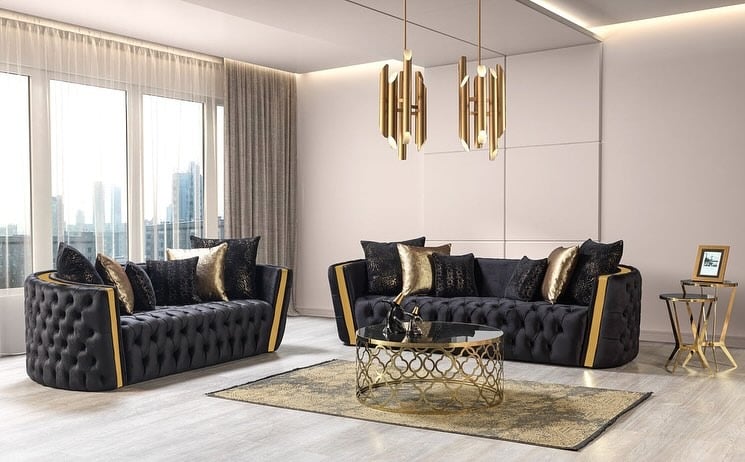 10. Tufted Black Sofas with Gold Detailing - black and gold living room ideas