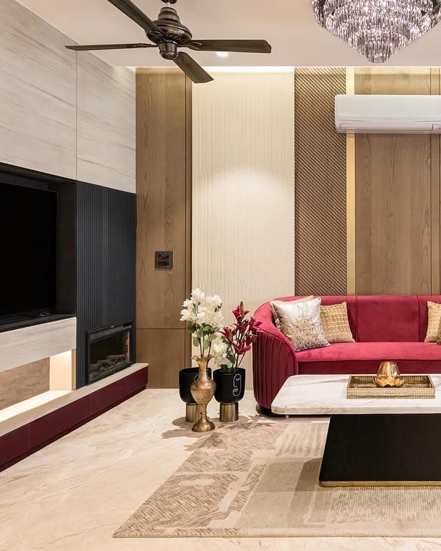 11. Contemporary Burgundy, Black, and Gold Living Room - black and gold living room ideas