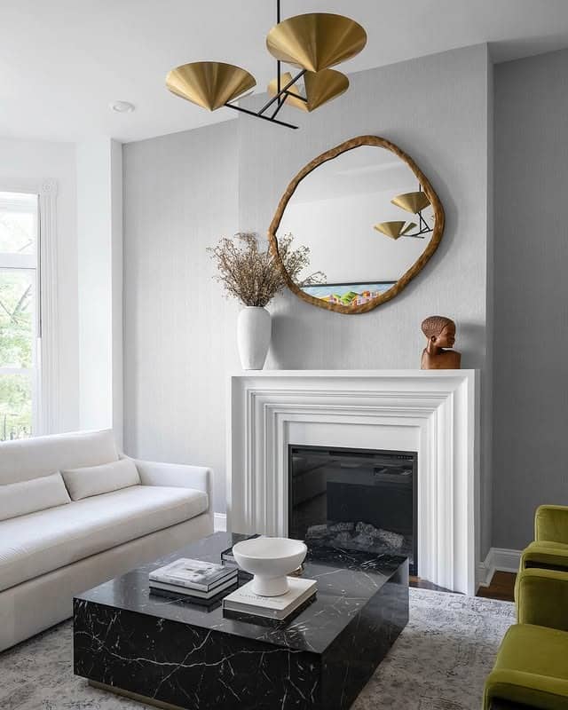 12. Soft Gray and Black Living Room with Gold Lighting - black and gold living room ideas