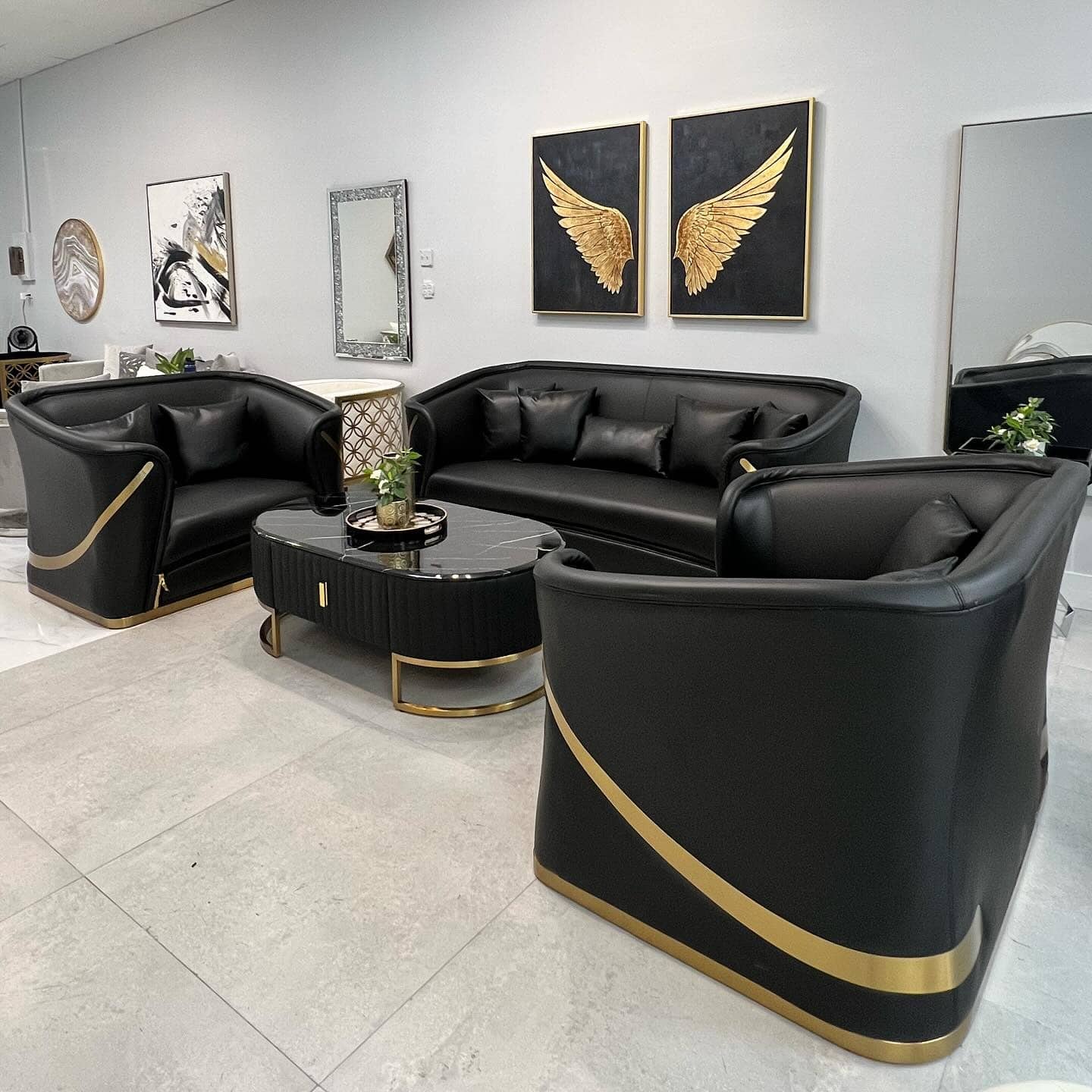 13. Sculptural Black and Gold Lounge Seating Arrangement - black and gold living room ideas