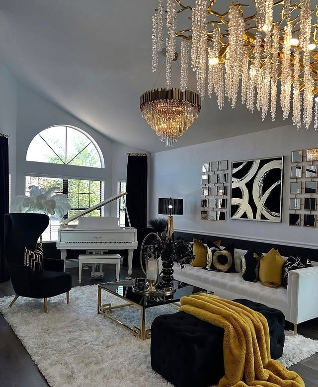 16. Formal Black and Gold Living Room with Crystal Lighting - black and gold living room ideas
