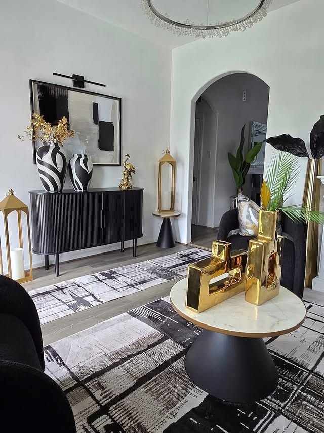 17. Modern Black and Gold Console Styling Living Room - black and gold living room ideas