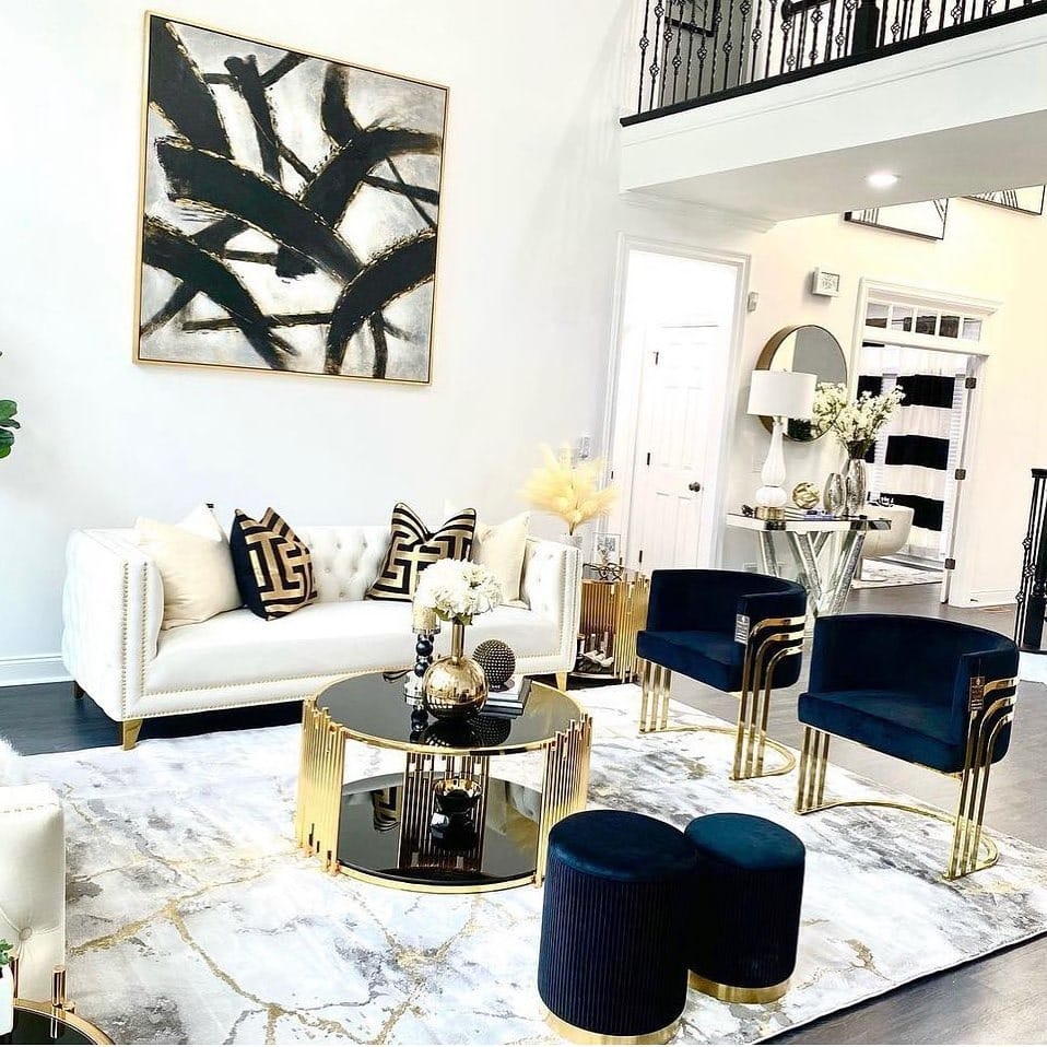 22. Glam Black, White, and Gold Living Room with Sculptural Seating - black and gold living room ideas