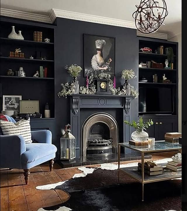17. Elegant Black Living Room with Statement Fireplace - black living room ideas