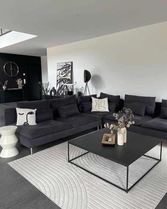 21. Modern Black Living Room with Soft Neutrals - black living room ideas