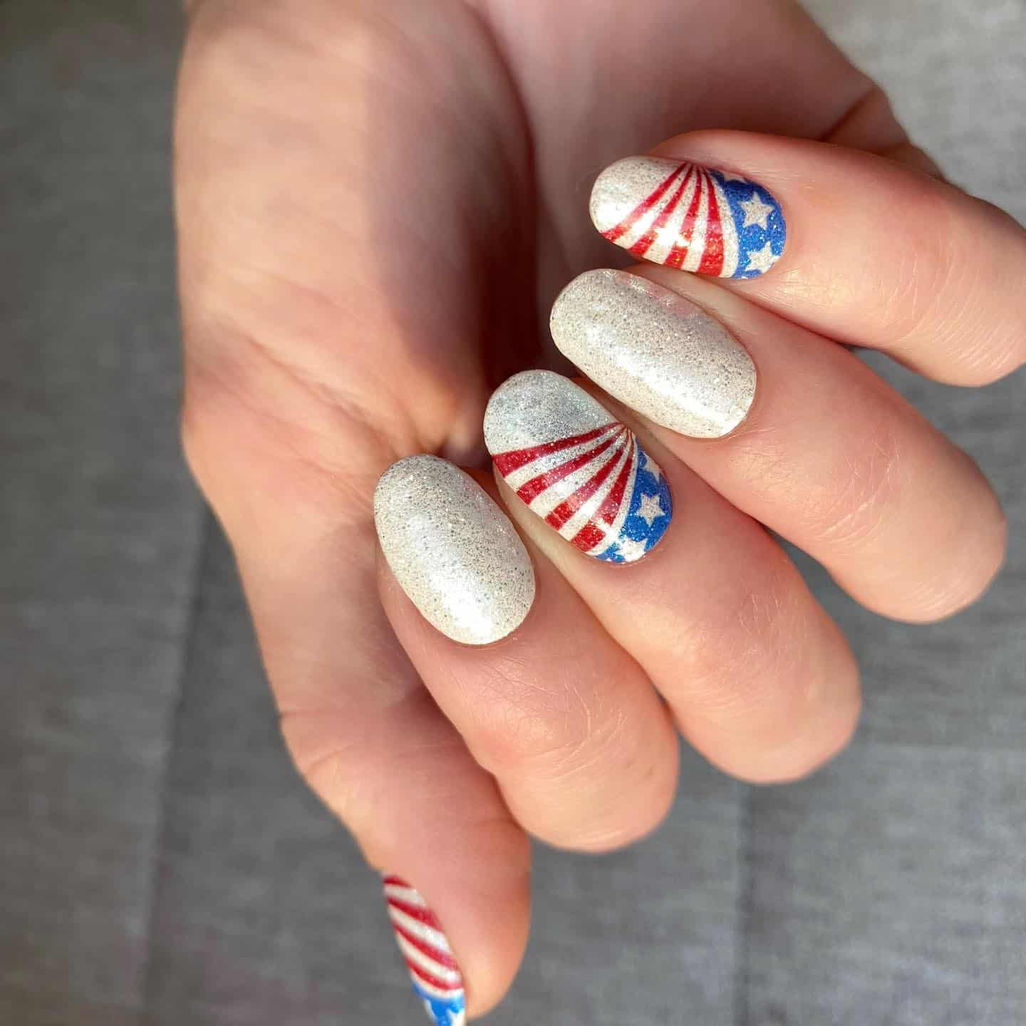 10. Glitter Neutral Nails with Flag Art - us flag nail ideas