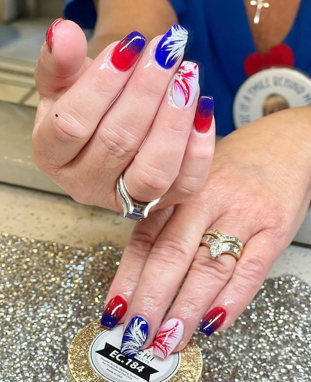 15. Patriotic Ombre Nails with Firework Accents - us flag nail ideas