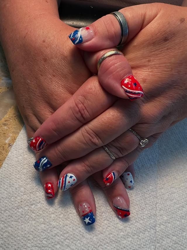 18. Short Patriotic Nails with Mixed Star Patterns - us flag nail ideas