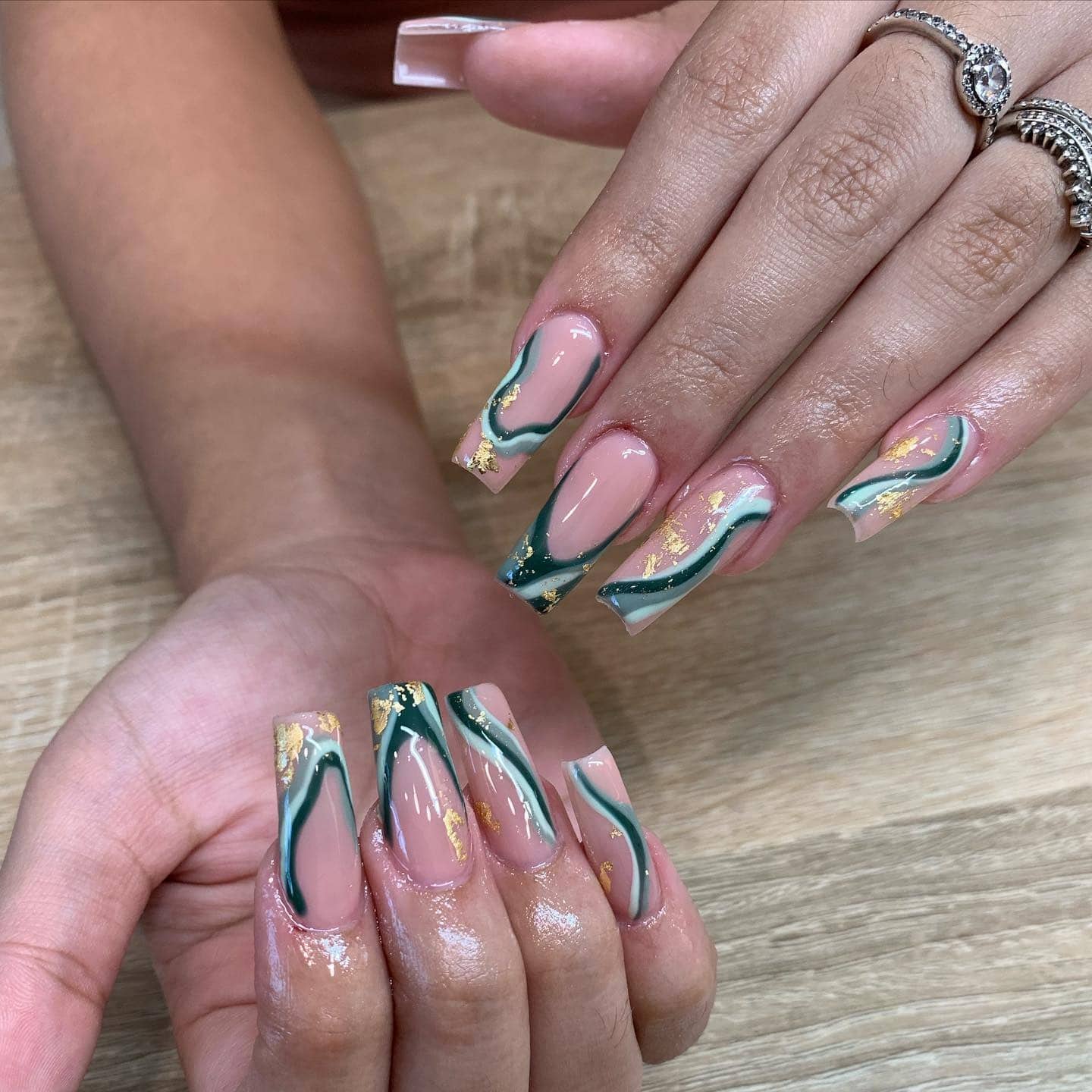 6. Emerald Wave Accents with Gold Foil - wavy nail ideas