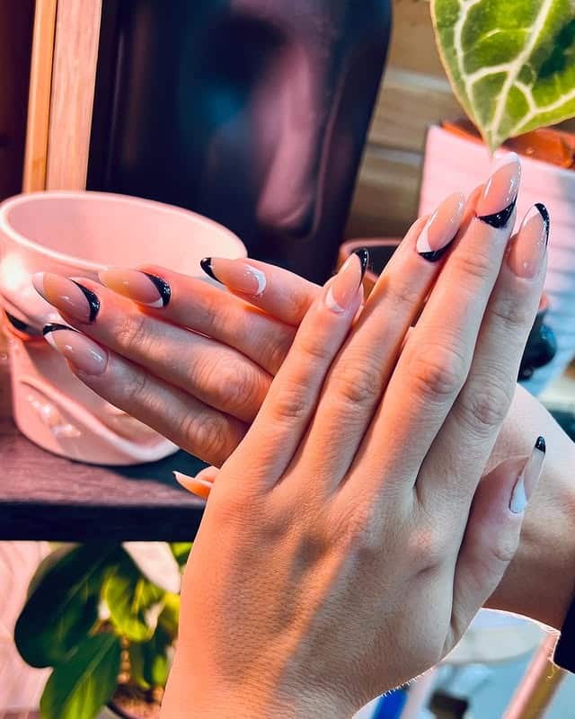 14. Black Crescent Wave Almond Nails - wavy nail ideas