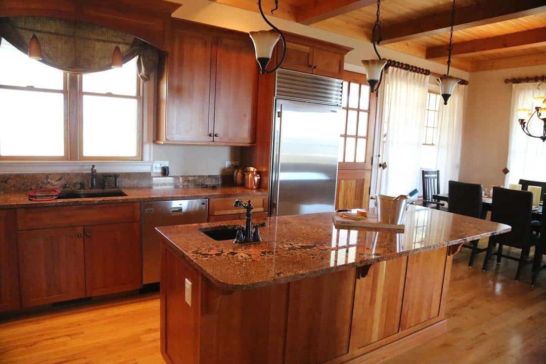 15. Traditional Wood Island in Honey Brown and Soft Beige - rustic kitchen island ideas