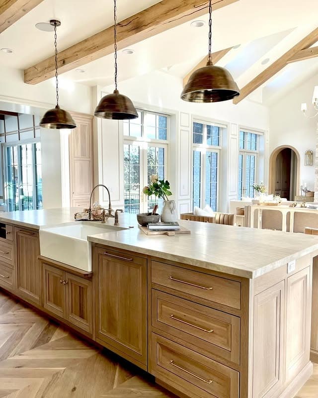 16. Elegant Rustic Island in Light Oak and Cream Stone - rustic kitchen island ideas