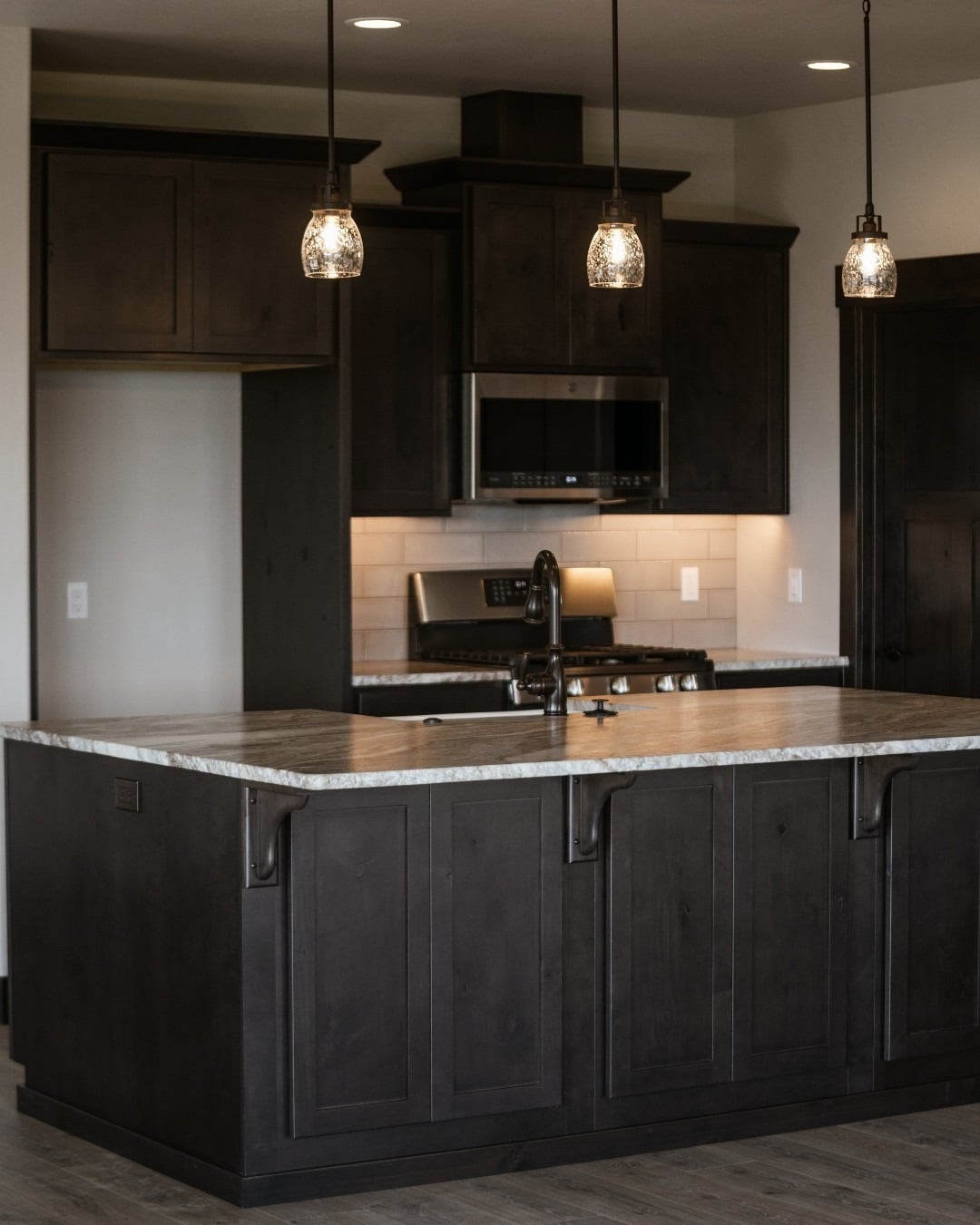 18. Moody Rustic Island in Charcoal Black and Gray Stone - rustic kitchen island ideas