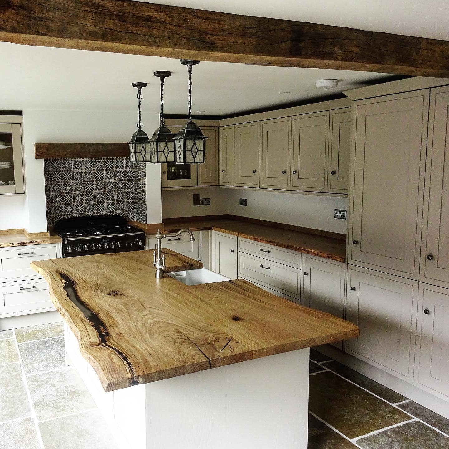 20. Live-Edge Island in Natural Wood and Warm Neutrals - rustic kitchen island ideas