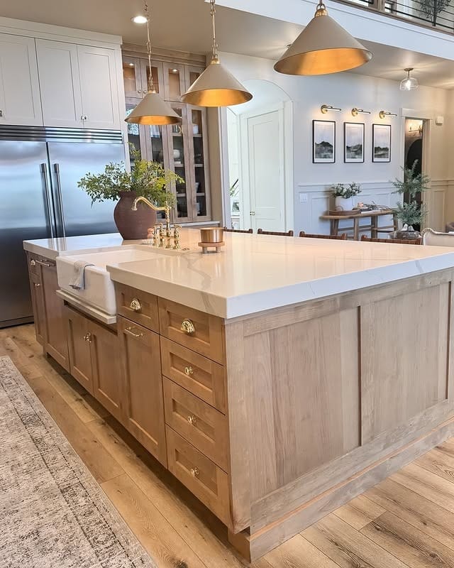 22. Natural Oak Statement Island with Cream Stone - rustic kitchen island ideas