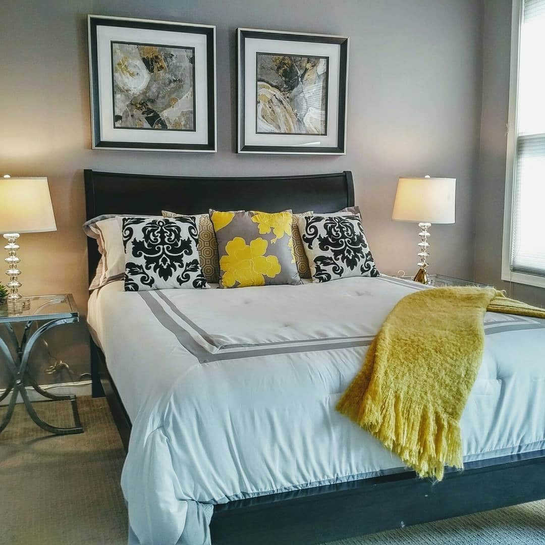 2. Classic Gray Bedroom with Yellow Accent Pillows - yellow and gray bedroom ideas