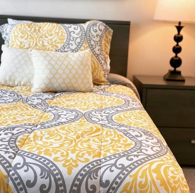 4. Traditional Yellow and Gray Patterned Bedding Style - yellow and gray bedroom ideas