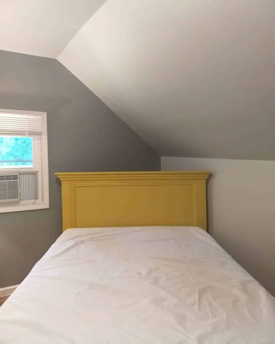 6. Minimal Gray Bedroom with Statement Yellow Headboard - yellow and gray bedroom ideas