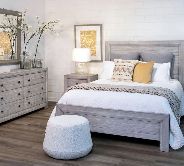 20. Rustic Gray Wood Bedroom with Yellow Accent Pillows - yellow and gray bedroom ideas