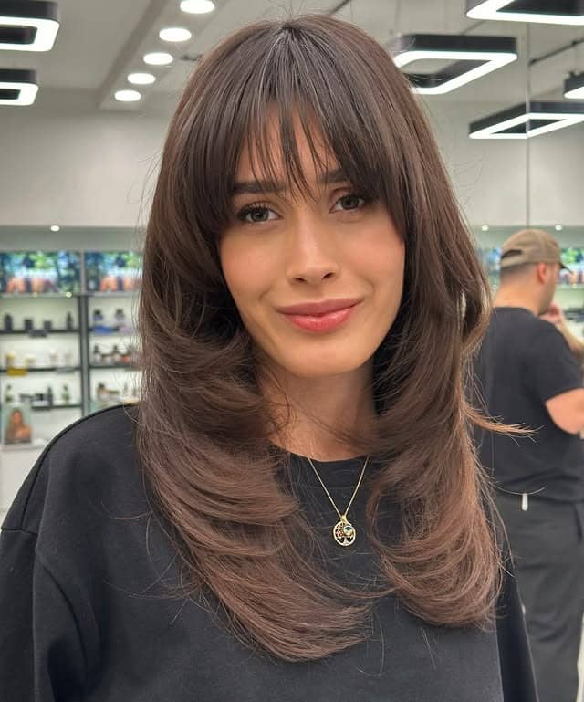 1. Soft Feathered Layers with Cocoa Brown - Curtain Bangs Hairstyles
