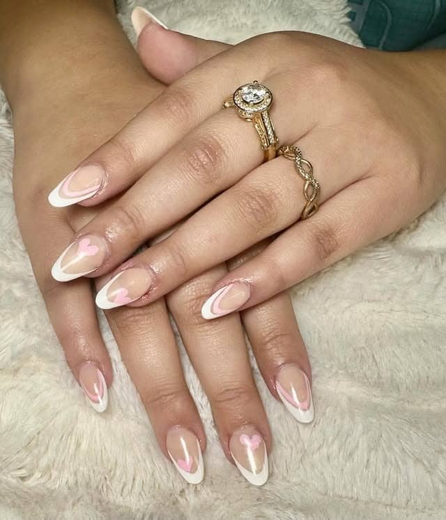 1. Soft Pink French Almond with Heart Accents - white almond nail ideas