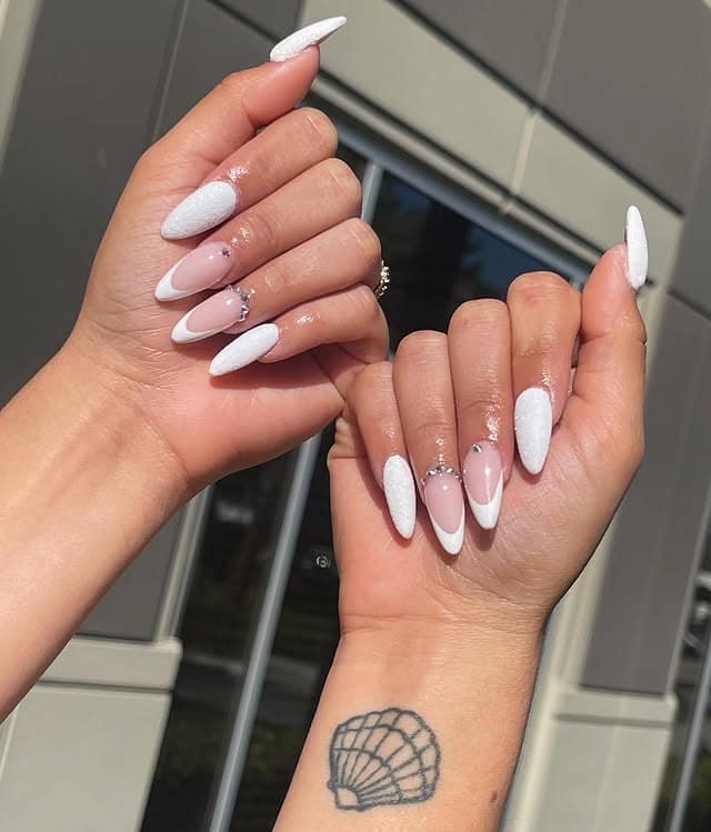 4. White Almond Nails with Crystal Accents - white almond nail ideas