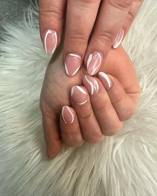 10. Short Almond Nude Nails with White Line Art - white almond nail ideas