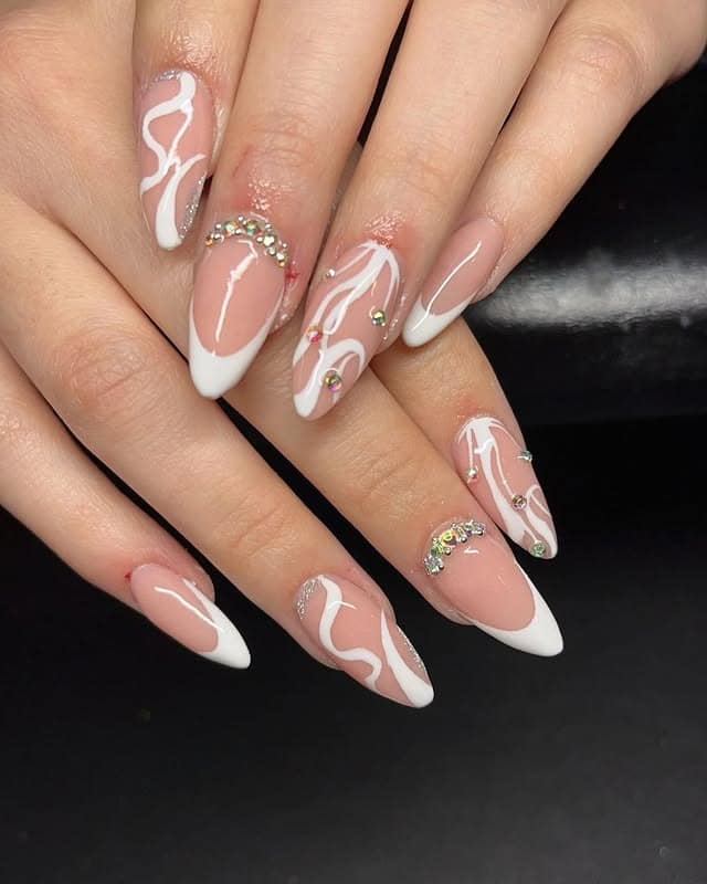 14. White French Almond Nails with Abstract Line Art - white almond nail ideas