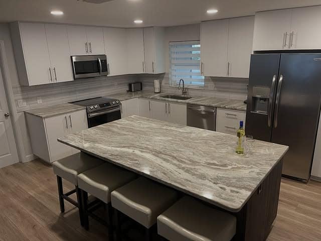 3. Gray Veined Granite for a Modern Family Kitchen - granite countertops kitchen ideas