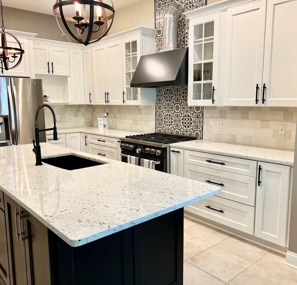 4. Soft White Granite with Bold Contrast Details - granite countertops kitchen ideas