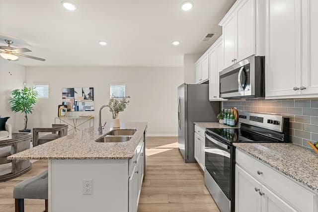 6. Light Granite Countertops in an Open-Concept Layout - granite countertops kitchen ideas