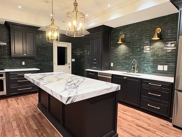 8. Dramatic Black Cabinets with White Granite Island - granite countertops kitchen ideas
