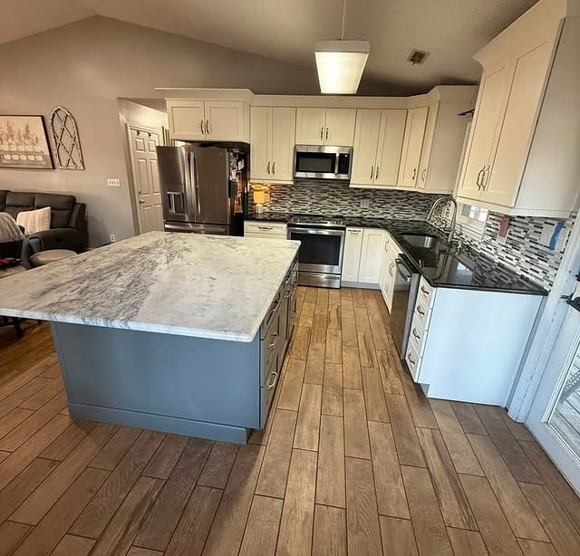 11. Soft Gray Granite with Clean White Cabinetry - granite countertops kitchen ideas