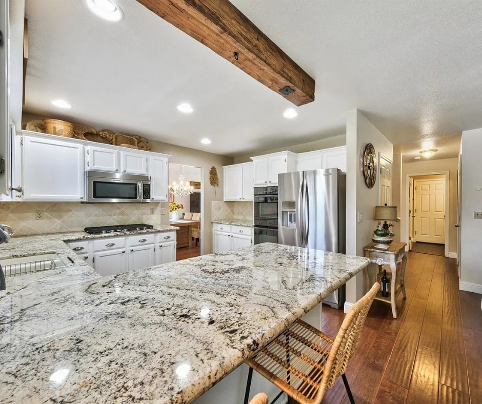 13. Cream Granite with Natural Wood Accents - granite countertops kitchen ideas