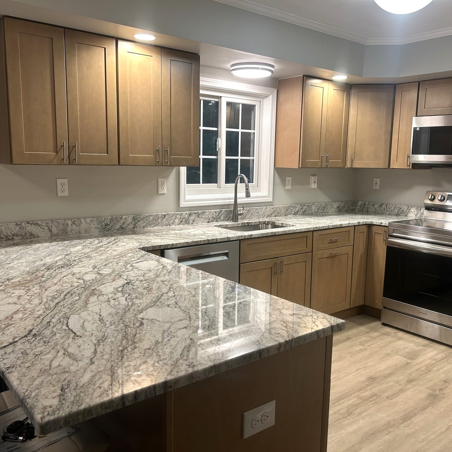 17. Polished Granite with Warm Maple Cabinetry - granite countertops kitchen ideas