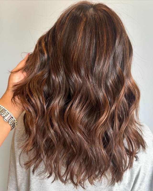 20. Chocolate Brown Waves with Warm Lived-In Highlights - Chocolate Brown Hair with Highlights